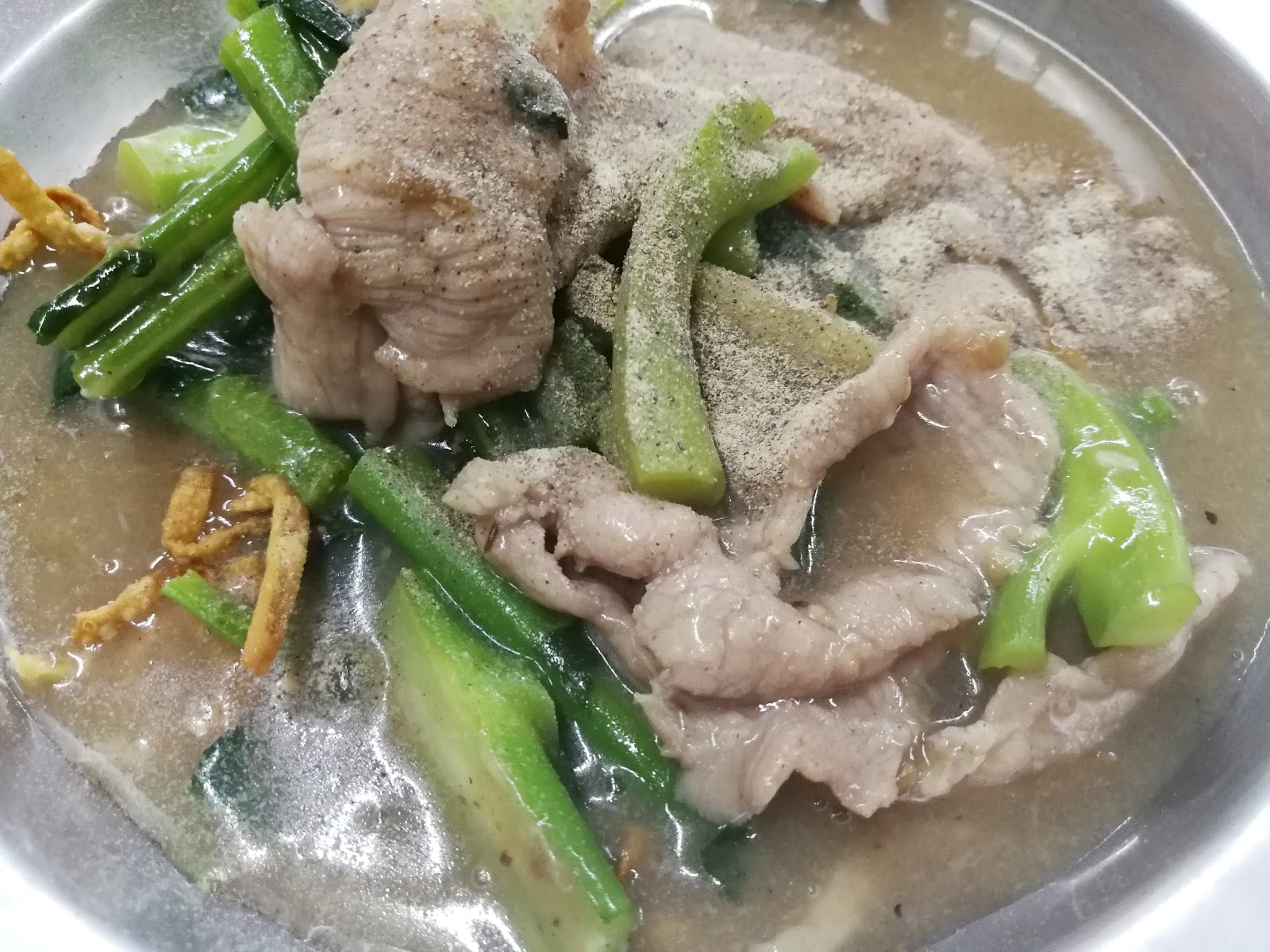 Noodles topped with vegetable sprouts