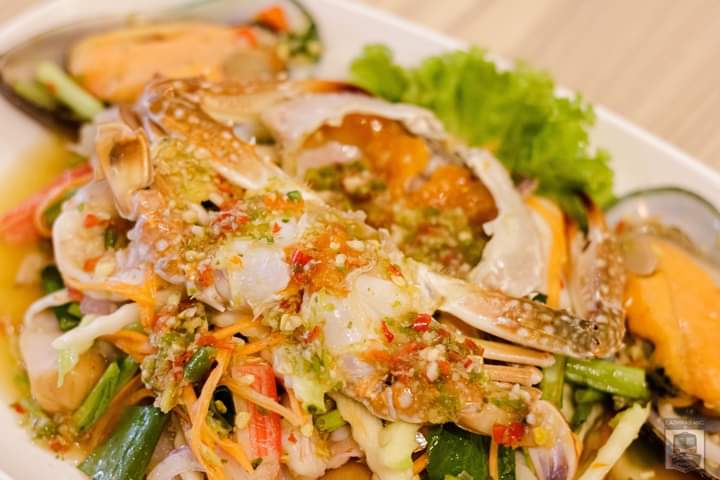 A crab embraces a shrimp marinated in fish sauce